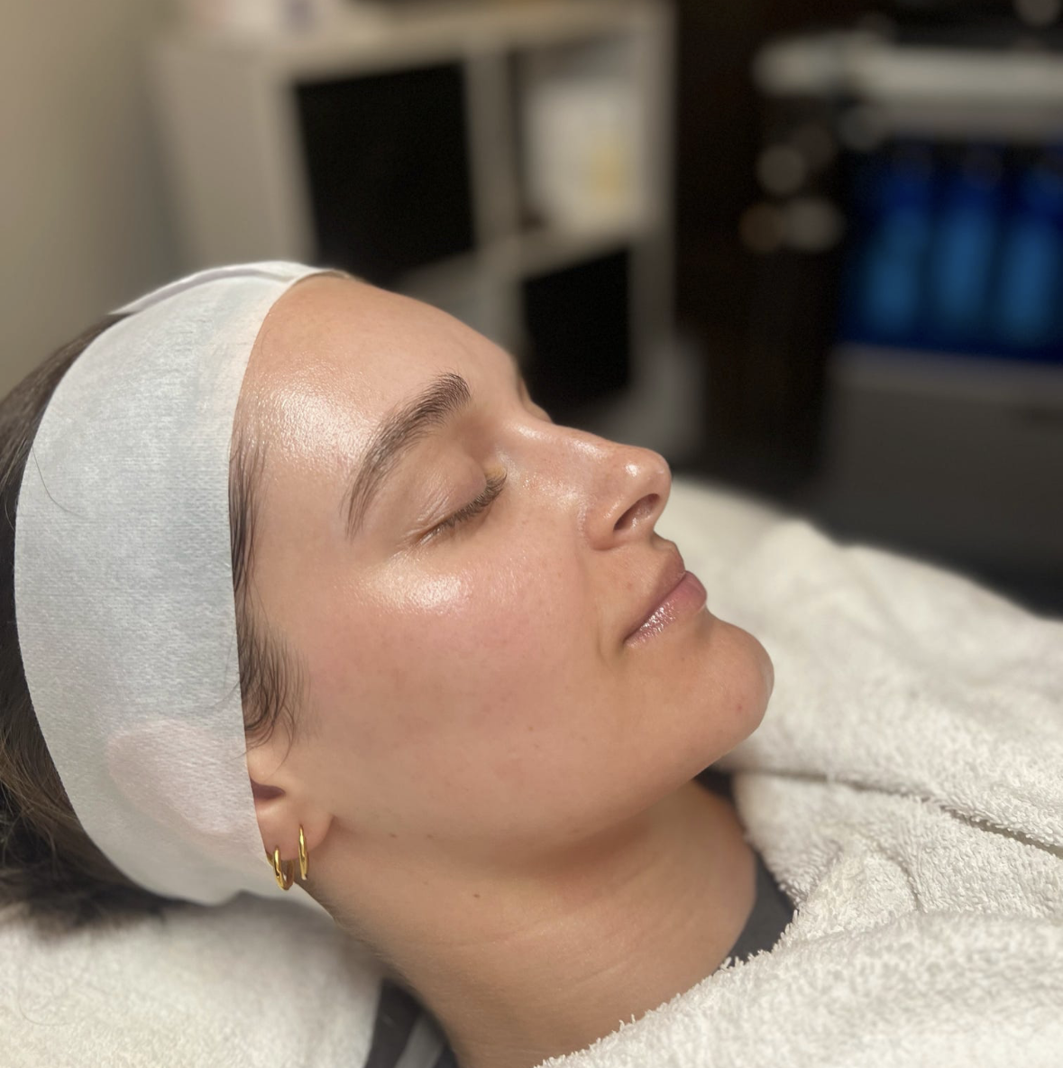 Client with glowing, refreshed skin after a Sunset Facial at Shine
